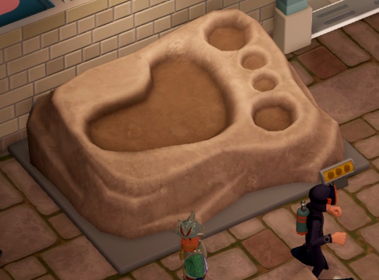 Een Wetlantean en een Marine Life Enthusiast wandelen voorbij een Right Footprint Fossil.